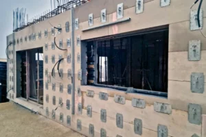 Installing facade panels for a durable exterior finish that protects the home and completes the architectural look.