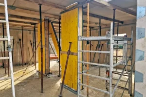 Building the thermal wall shell to keep warmth inside and reduce energy loss in a passive house structure.